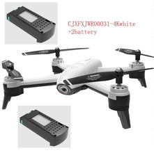 Dolphin Tracker aerial drone with RFID technology for lost recovery, flying outdoors over a scenic landscape.
