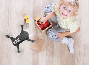 Dolphin Tracker aerial drone with RFID technology for lost recovery, shown flying in the sky with camera and sensors.