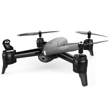 Dolphin Tracker aerial drone with RFID technology for lost recovery, flying over a scenic landscape with camera equipment attached.
