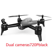Aerial drone by Dolphin Tracker with RFID for lost recovery, flying over a landscape with clear blue skies and open fields.