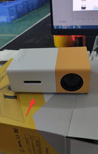 Dolphin Tracker YG300 portable 3D HD LED projector displaying home theater cinema with HDMI, USB, and audio features.