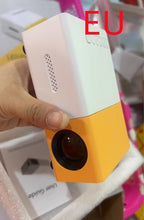 Dolphin Tracker LED portable 3D HD projector displaying home theater scene with HDMI and USB connections.