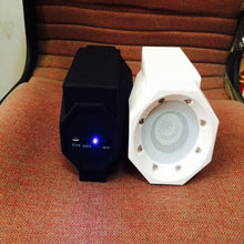 Dolphin Tracker magnetic induction resonance speaker with RFID technology, showcasing sleek design and functional features.